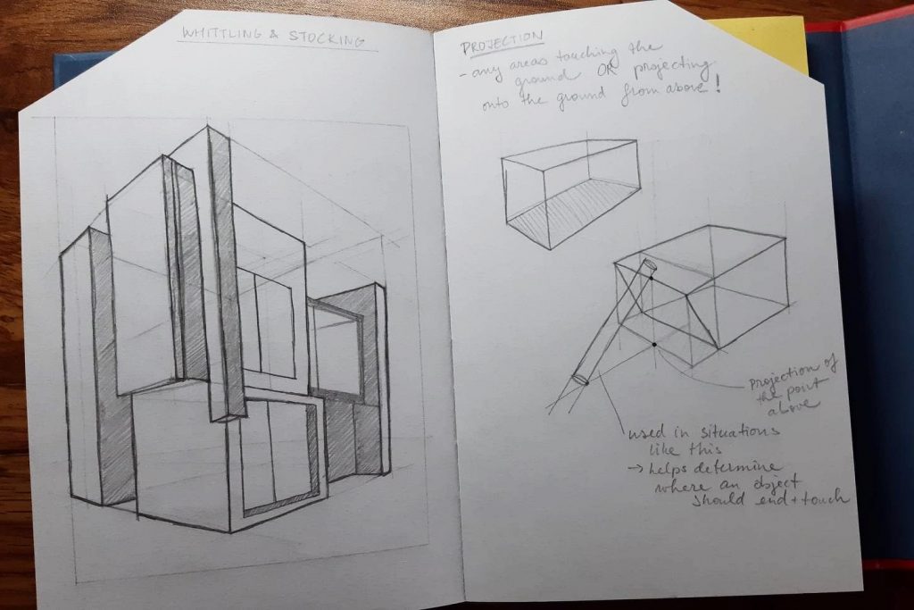 notebook opened on a page with geometrical sketches and notes